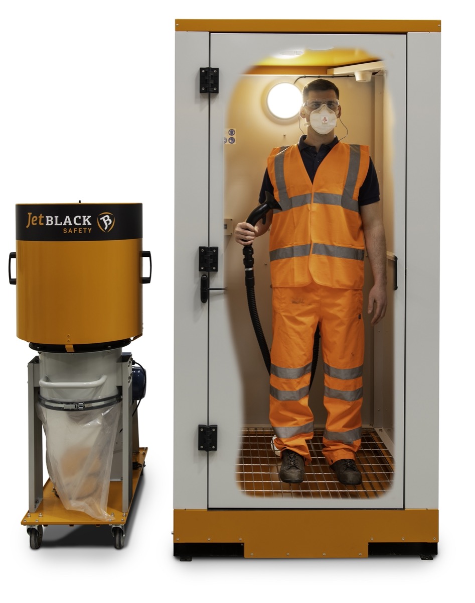 Front view of the JetBlack Safety Personnel Cleaning booth with extractor, with cutout to show person inside (in PPE) using the air blower
